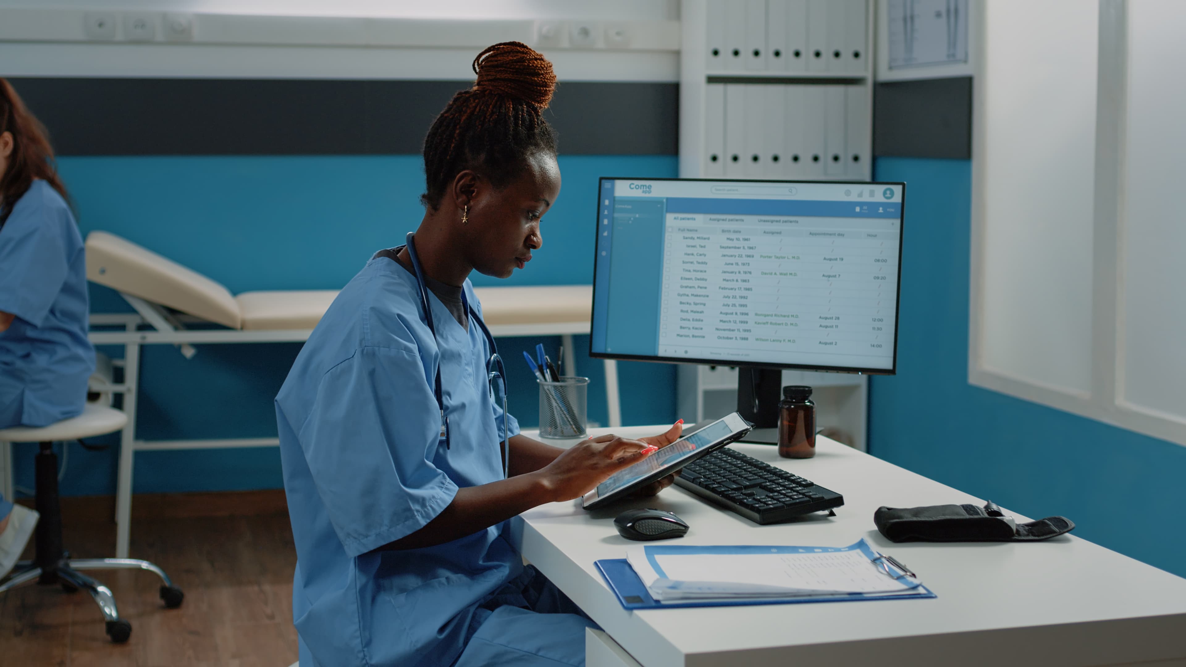 Healthcare professionals using a digital hospital management system