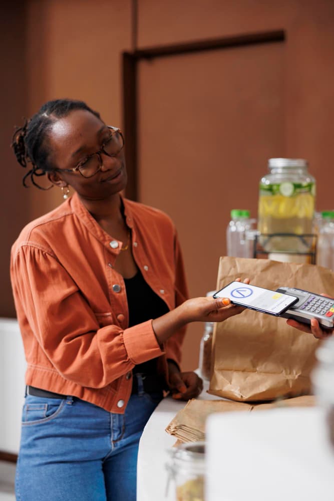 Cashier processing a point-of-sale transaction